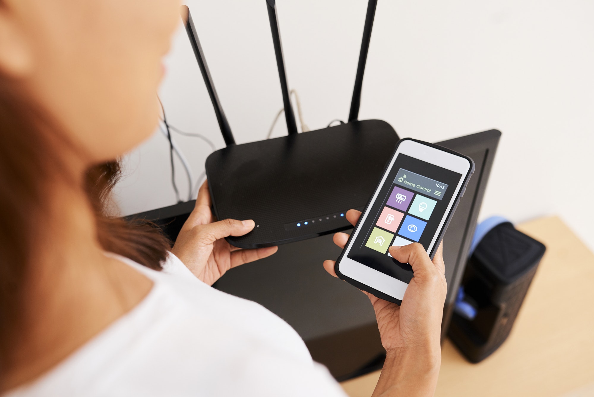 woman connecting to wi fi router